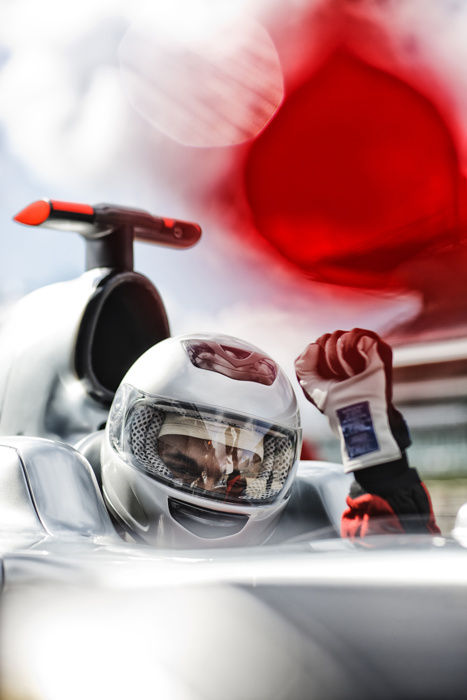 Racer cheering in car on track